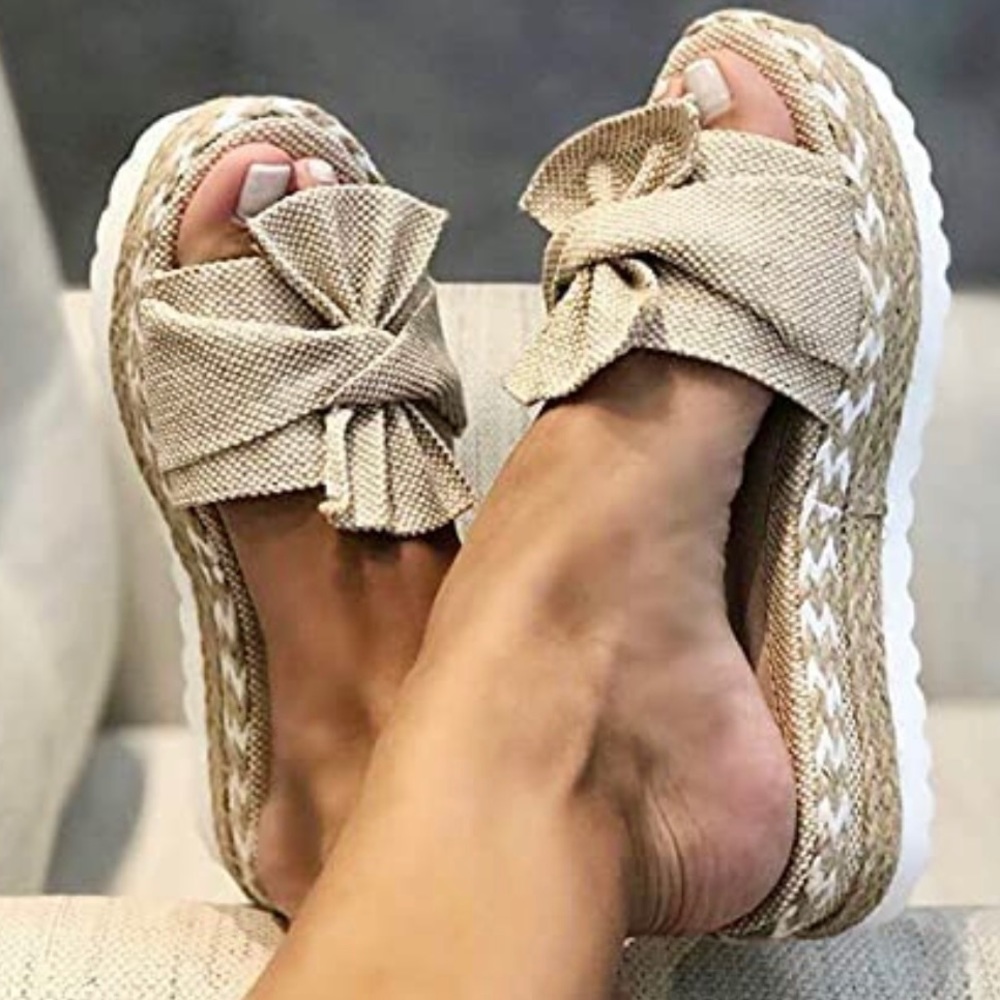 Womens platform sandal. Worn once beige color with bow!